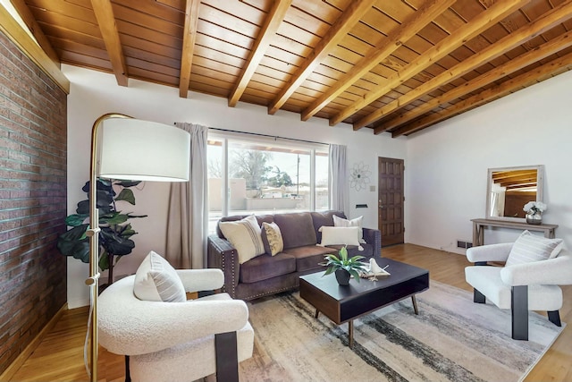 living room with visible vents, vaulted ceiling with beams, wood ceiling, and light wood-type flooring