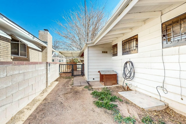 view of patio featuring fence