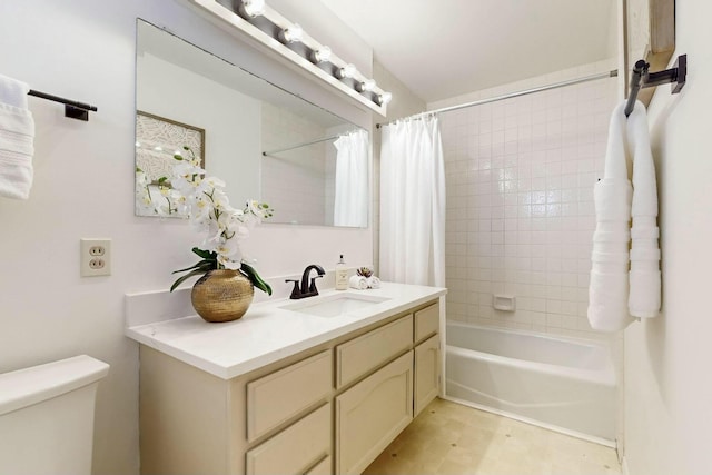 bathroom featuring toilet, vanity, and shower / bath combination with curtain