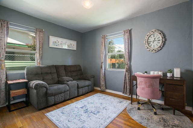 office space with baseboards and hardwood / wood-style flooring