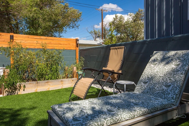 exterior space with a vegetable garden and fence