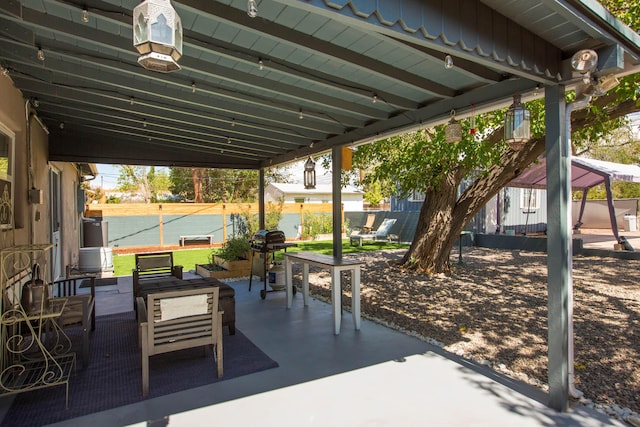 view of patio featuring a gazebo and fence