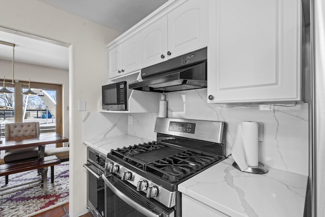 kitchen featuring under cabinet range hood, white cabinetry, stainless steel appliances, and light stone countertops