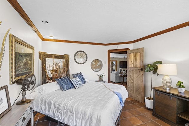 bedroom with dark tile patterned flooring and crown molding