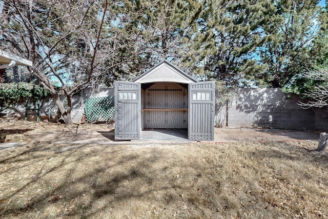 view of shed featuring a fenced backyard