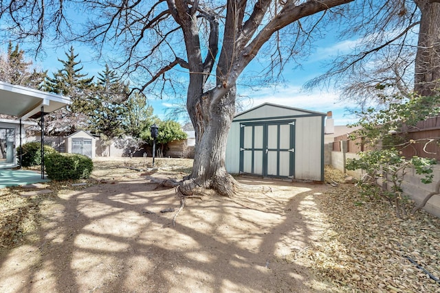 view of shed featuring a fenced backyard