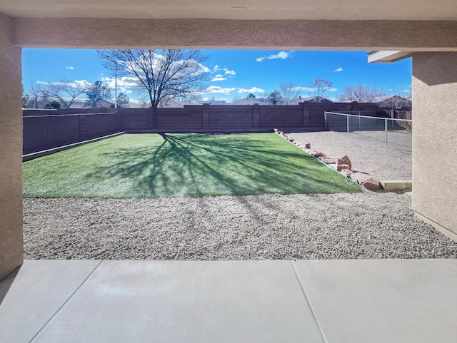 view of yard featuring a patio and a fenced backyard