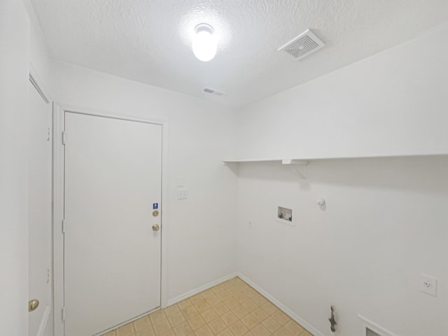 laundry area with hookup for a washing machine, visible vents, laundry area, a textured ceiling, and hookup for a gas dryer