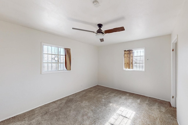 unfurnished bedroom featuring multiple windows, ceiling fan, and carpet flooring