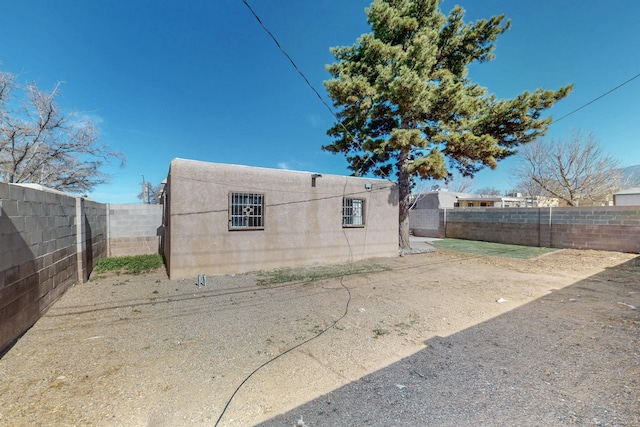 view of side of property with a fenced backyard