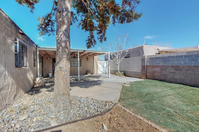 view of yard featuring a patio area and fence