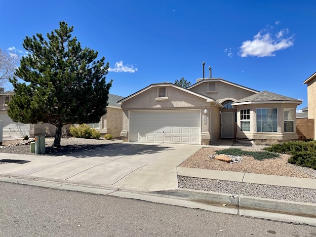 ranch-style home with stucco siding, concrete driveway, and an attached garage