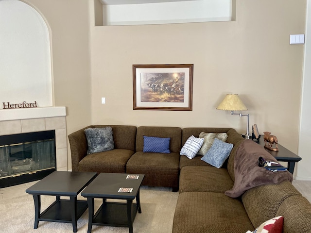 carpeted living area featuring a fireplace