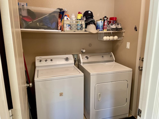 laundry room featuring washer and clothes dryer and laundry area