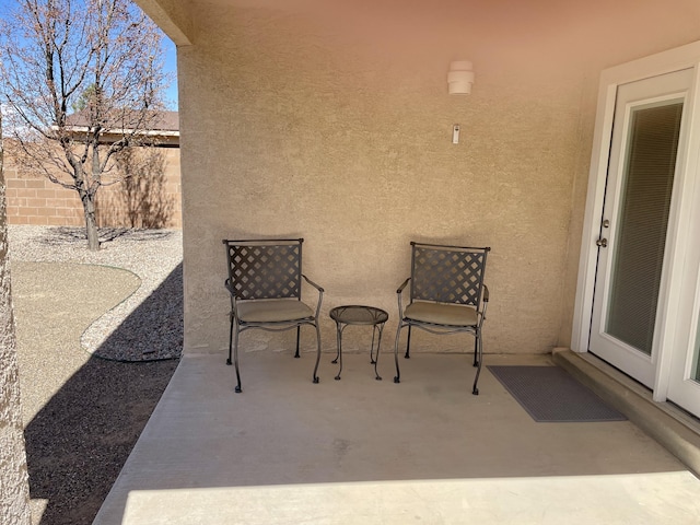 view of patio / terrace featuring fence