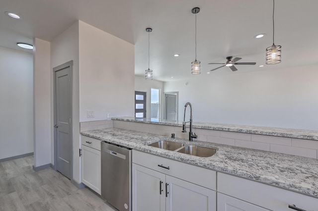 kitchen with dishwasher, ceiling fan, white cabinetry, and a sink