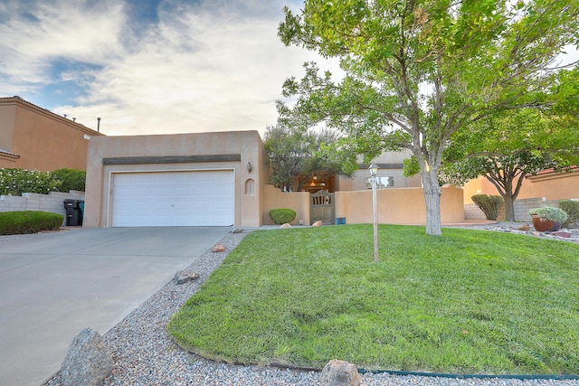 view of front of house with stucco siding, driveway, a garage, and fence