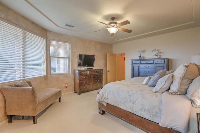 bedroom featuring visible vents, carpet flooring, and a ceiling fan