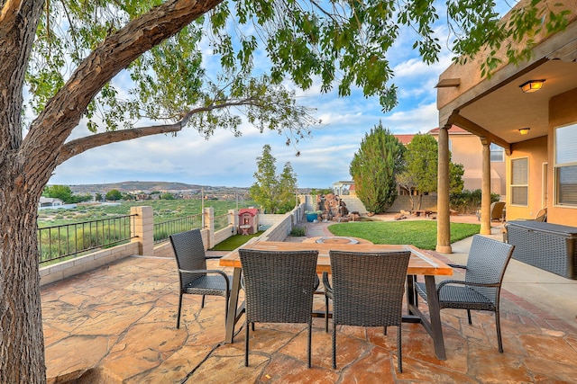 view of patio / terrace with outdoor dining area and a fenced backyard