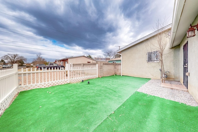 view of yard with a fenced backyard