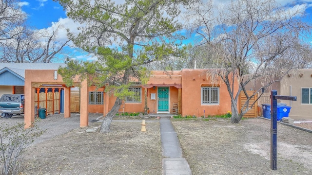 southwest-style home featuring a garage