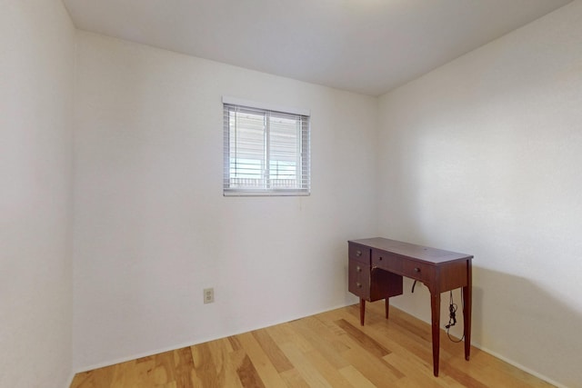 spare room featuring light wood-type flooring