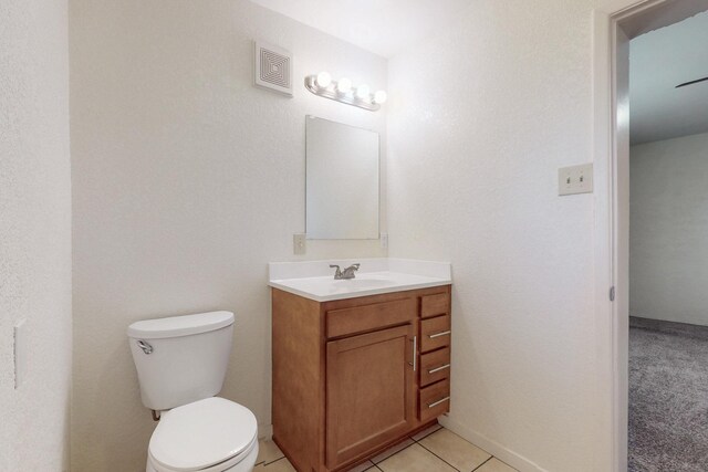 1505 Walter St SE, Albuquerque, NM 87102 - half bathroom with toilet, vanity, and tile patterned floors