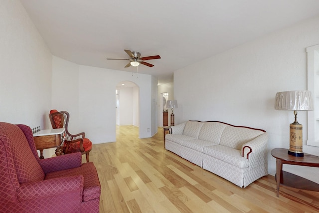 1505 Walter St SE, Albuquerque, NM 87102 - living area with arched walkways, wood finished floors, and ceiling fan