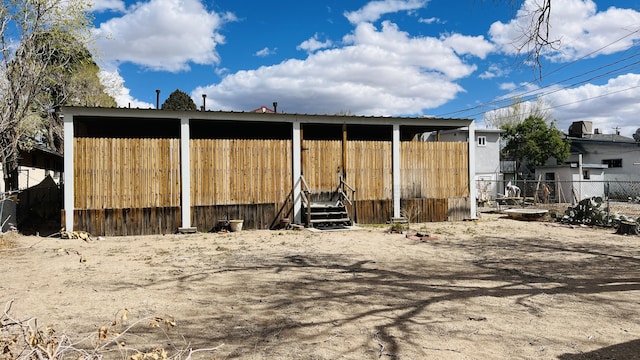 view of outdoor structure with fence