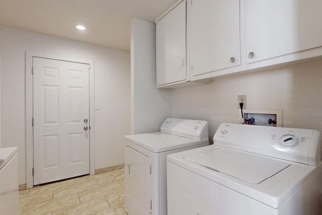 washroom with recessed lighting, cabinet space, and washer and dryer