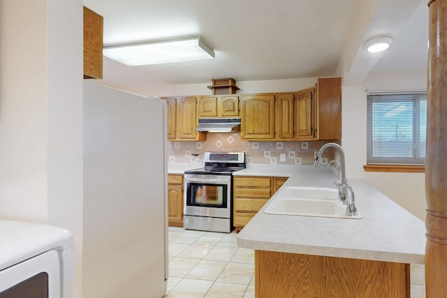 kitchen with under cabinet range hood, light countertops, decorative backsplash, stainless steel range with electric stovetop, and a sink