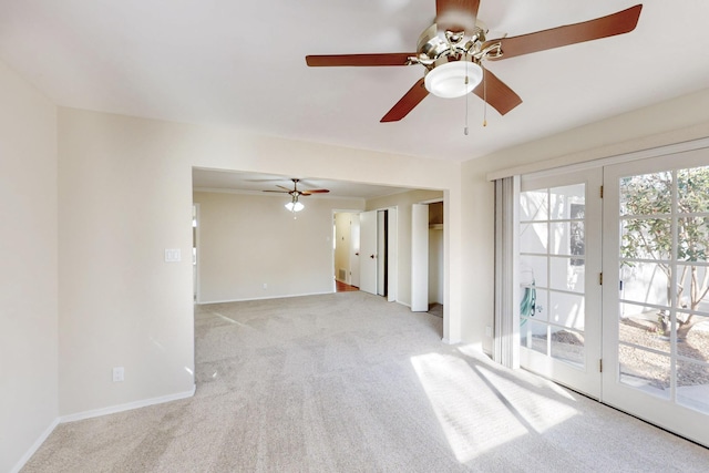 empty room with light carpet, baseboards, and a ceiling fan