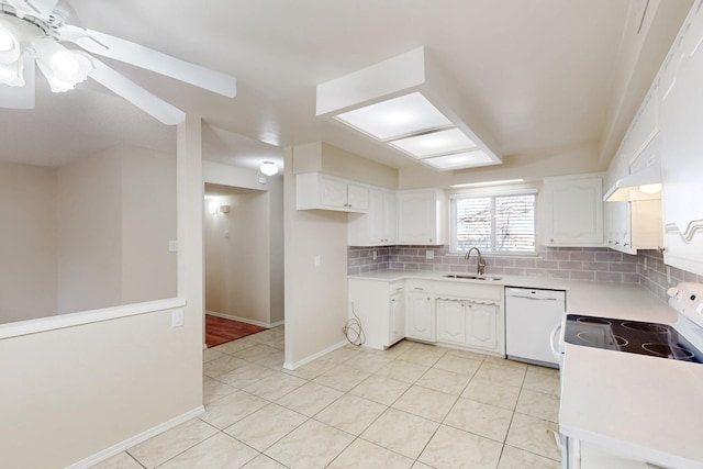 kitchen with backsplash, light countertops, white cabinets, white appliances, and a sink