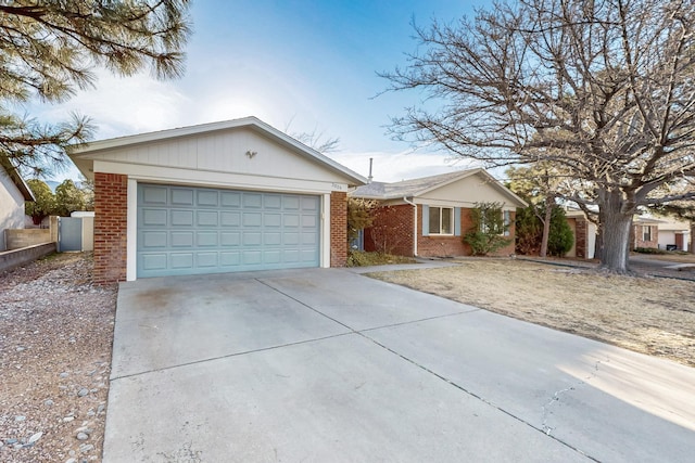 ranch-style house featuring brick siding and concrete driveway