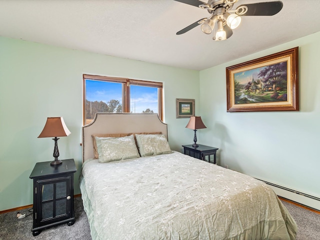 bedroom with baseboard heating, baseboards, carpet floors, and ceiling fan