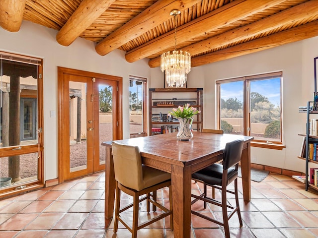 dining room with light tile patterned floors, baseboards, an inviting chandelier, wooden ceiling, and beamed ceiling