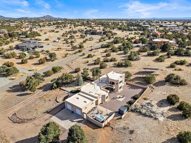 aerial view featuring a mountain view and a desert view