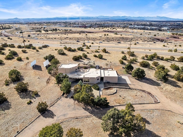 aerial view featuring a mountain view, a rural view, and a desert view