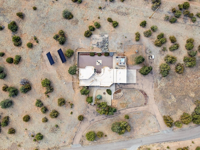 birds eye view of property featuring view of desert