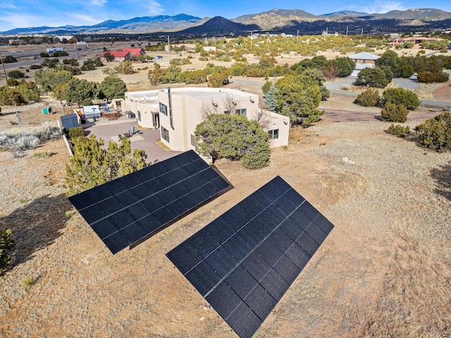 birds eye view of property featuring a mountain view