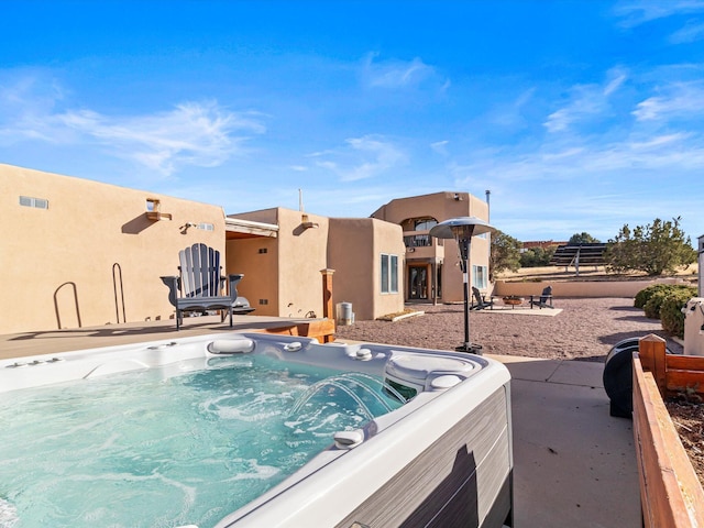 view of pool featuring a hot tub