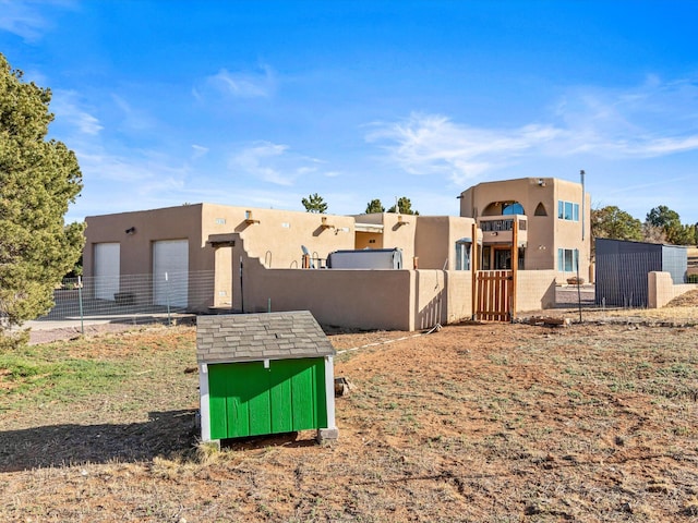 view of yard with a fenced front yard and a garage