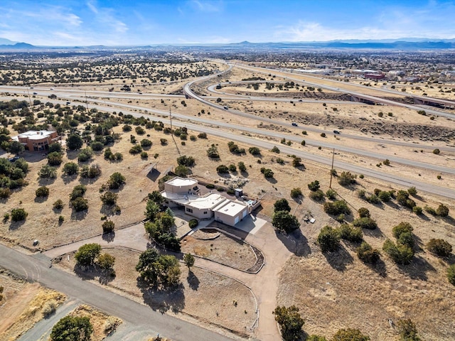 aerial view with view of desert, a rural view, and a mountain view