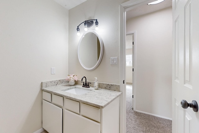 bathroom featuring vanity and baseboards