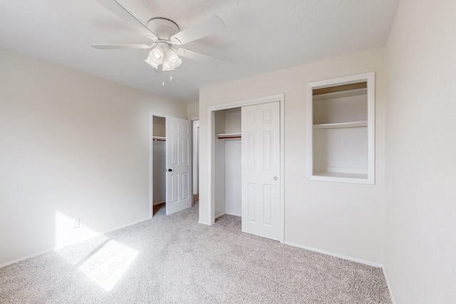 unfurnished bedroom with baseboards, carpet floors, and ceiling fan