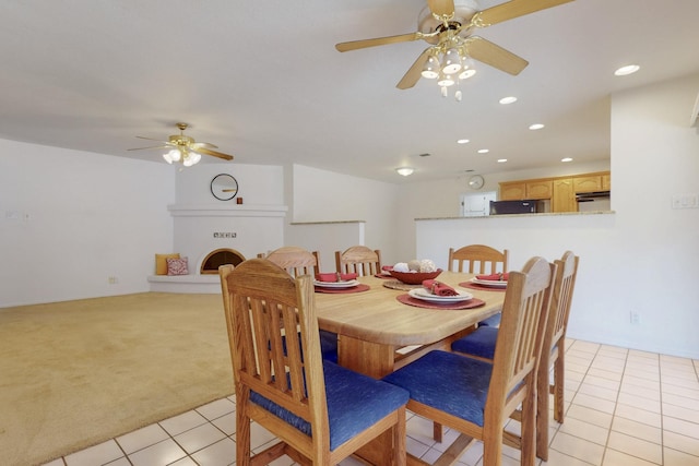 dining area featuring recessed lighting, light tile patterned floors, a ceiling fan, and light colored carpet