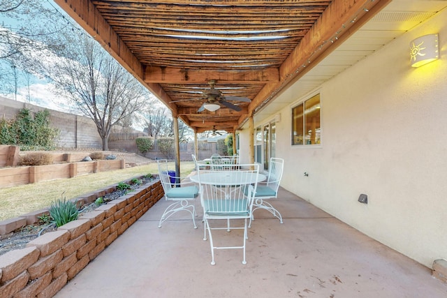 view of patio / terrace with a ceiling fan, outdoor dining area, and a fenced backyard