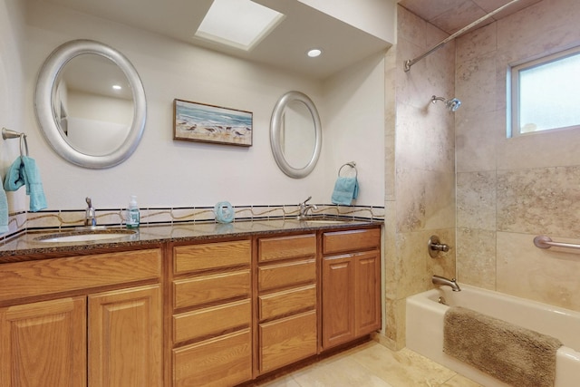 bathroom with a sink, tub / shower combination, double vanity, and tile patterned floors