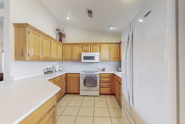 kitchen with light countertops, vaulted ceiling, light tile patterned floors, recessed lighting, and white appliances