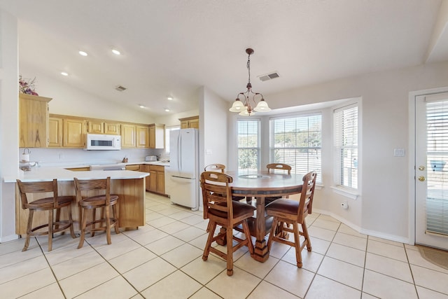 dining area featuring visible vents, lofted ceiling, light tile patterned floors, recessed lighting, and a notable chandelier